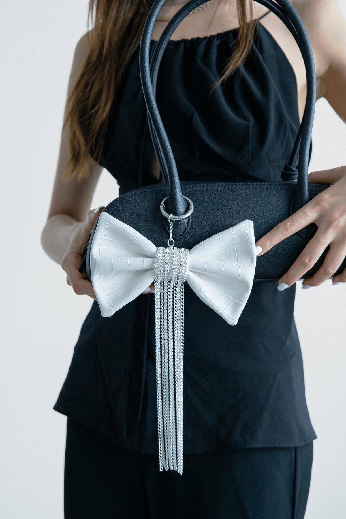 Crocodile-Embossed Bow With Cascading Fringe Chain Charm