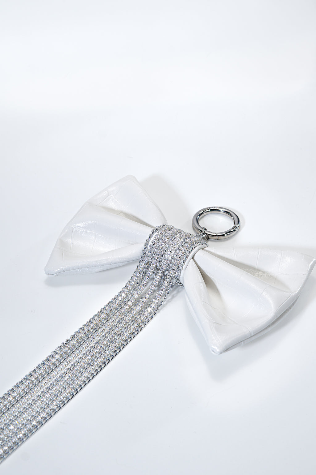 Crocodile-Embossed Bow With Cascading Fringe Chain Charm