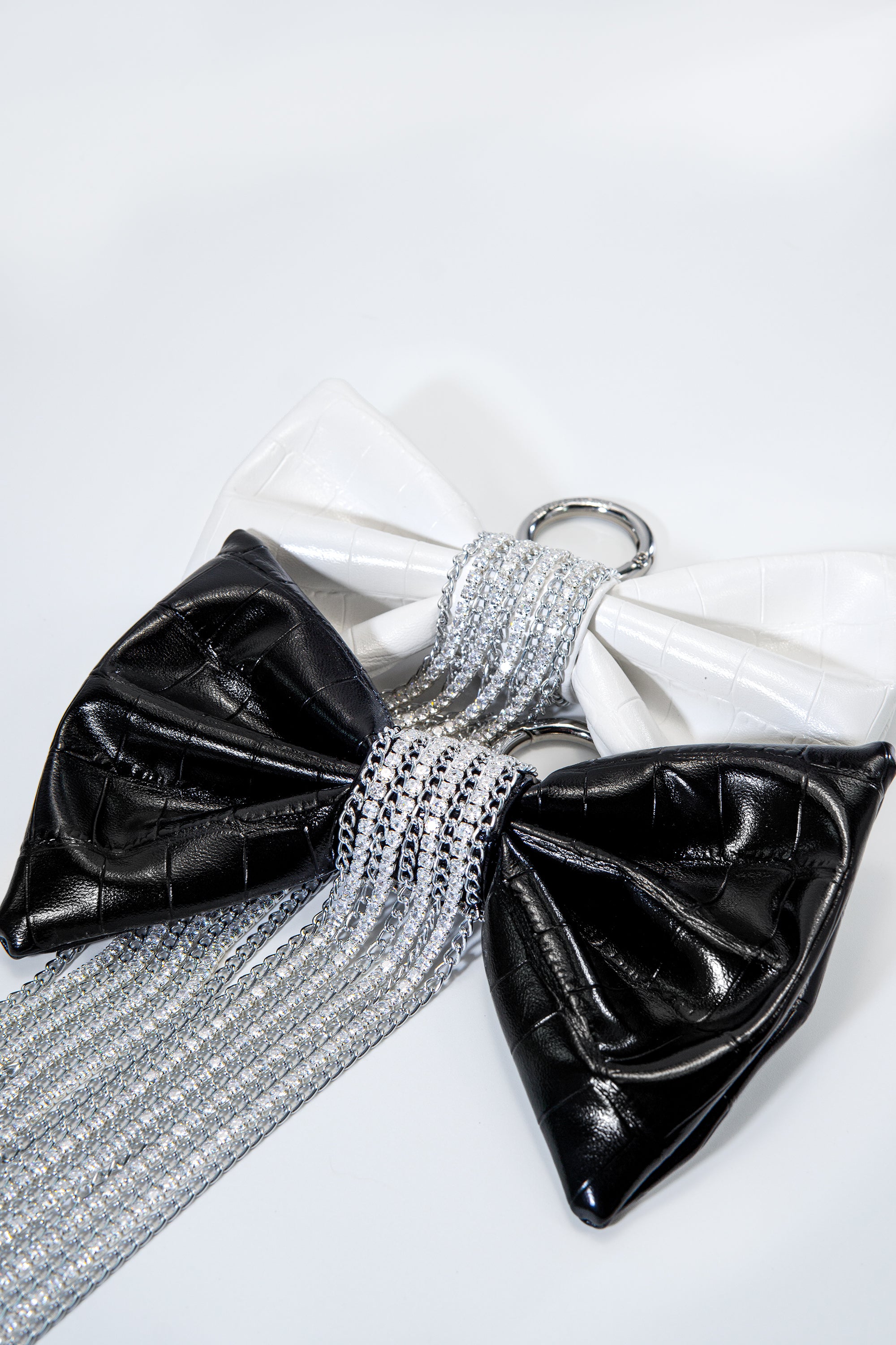 Crocodile-Embossed Bow With Cascading Fringe Chain Charm