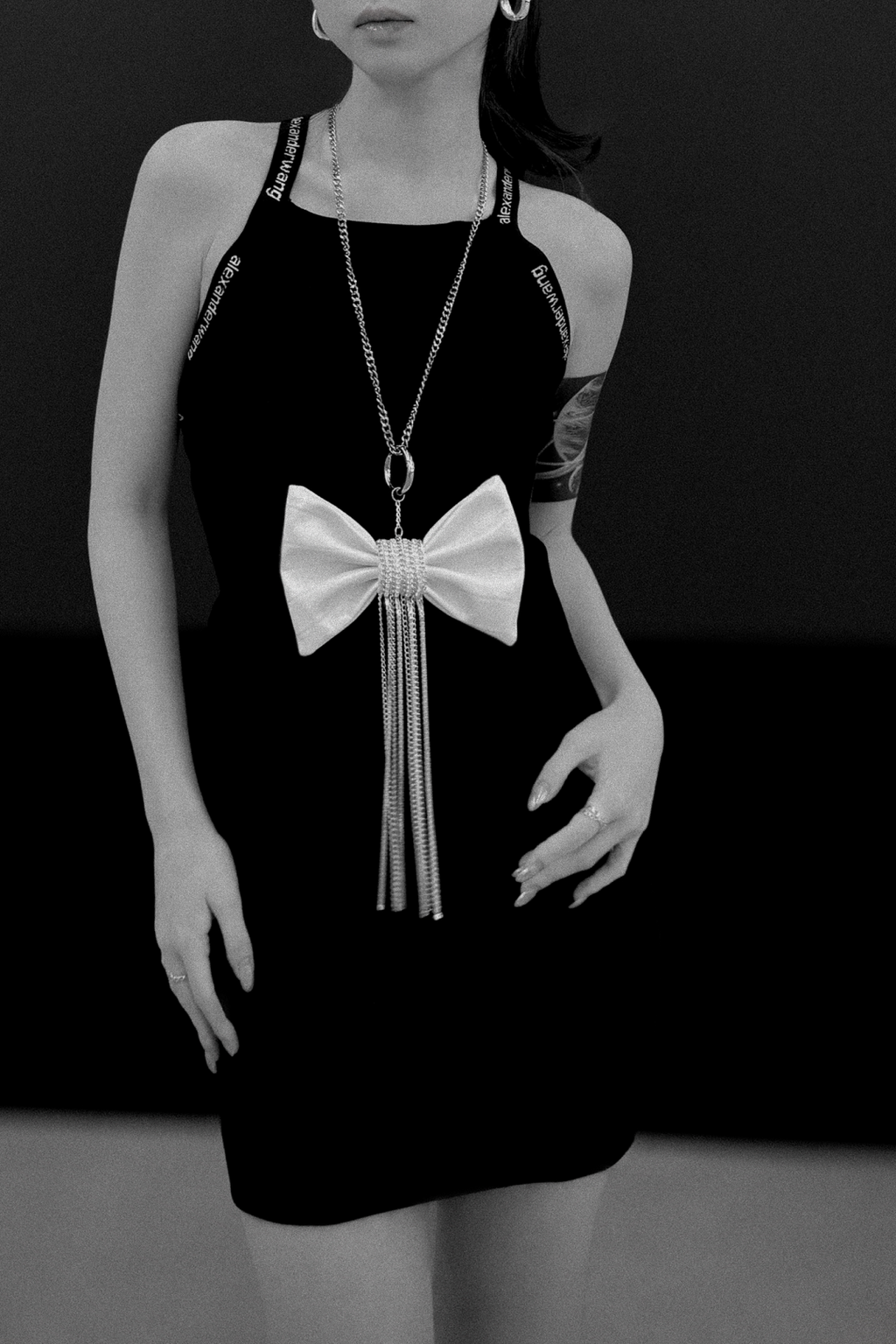 Crocodile-Embossed Bow With Cascading Fringe Chain Charm