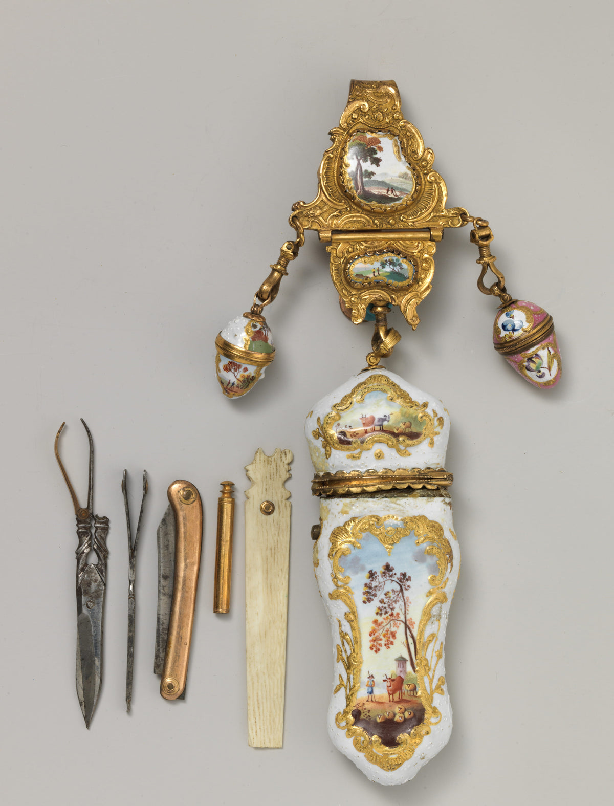 Enamelled copper nécessaire and châtelaine from around 1765 with small tools laid out beside it